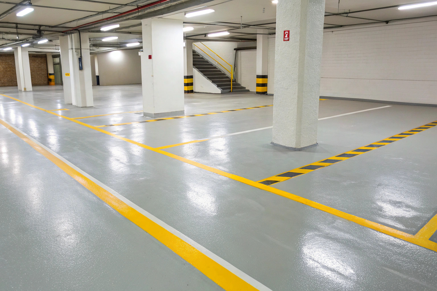 Epoxy-coated basement carpark with line marking near the Brick Pit precinct, Kirrawee