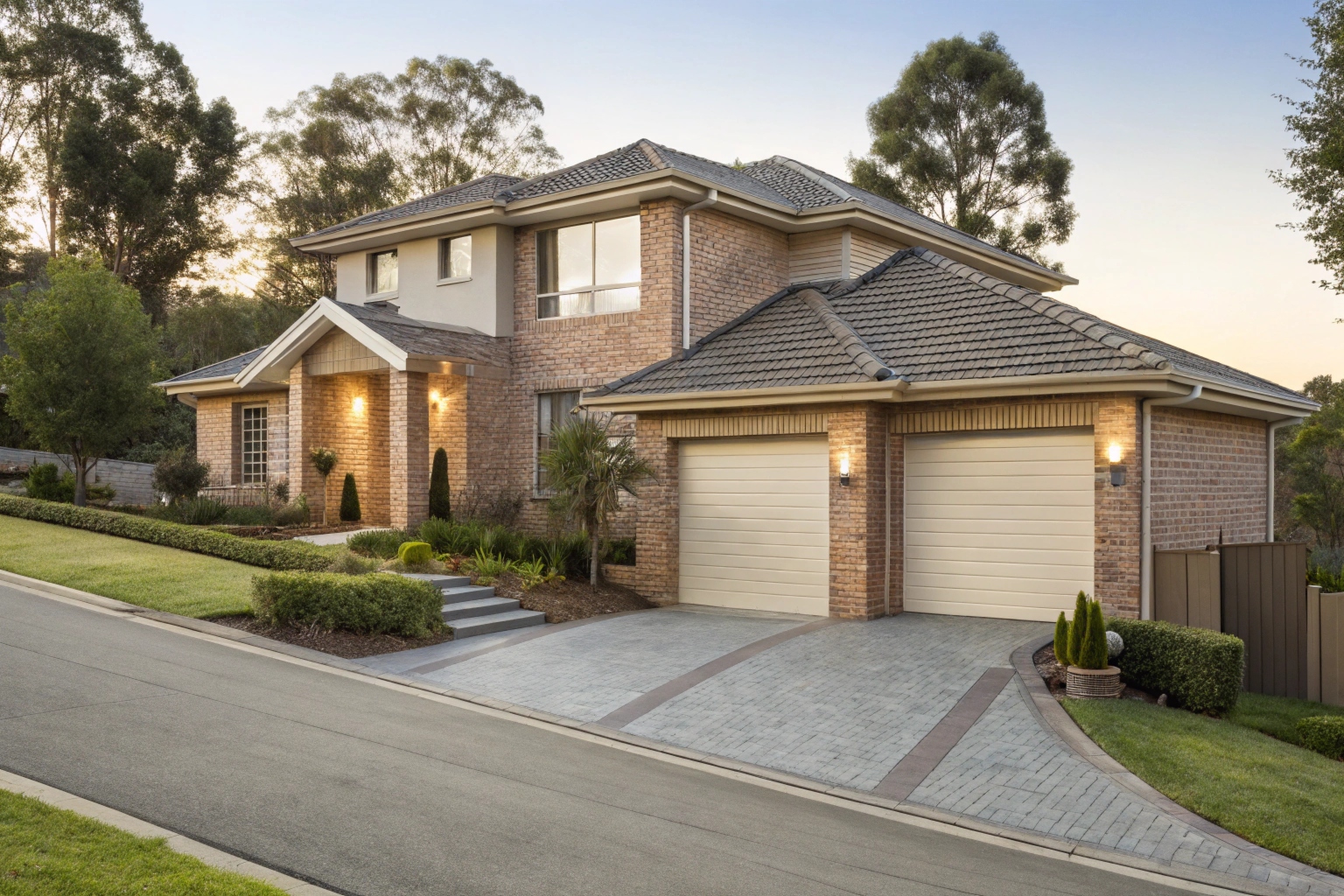 Modern brick home with a double garage and sloped driveway in Menai, NSW