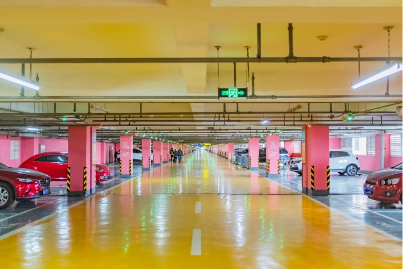 A yellow-toned epoxy floor in a commercial basement space