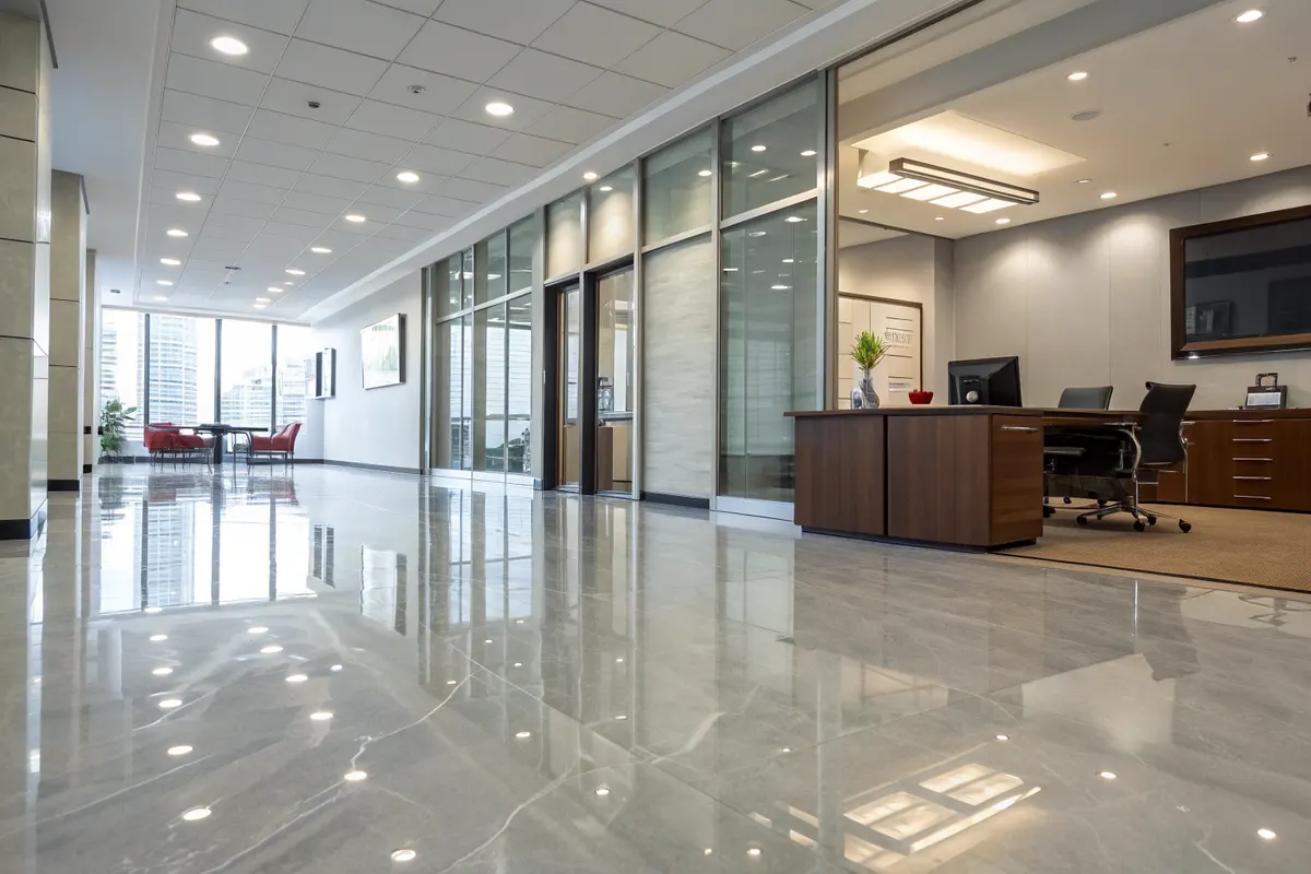 Modern office floor with reflective epoxy flooring in an executive workspace